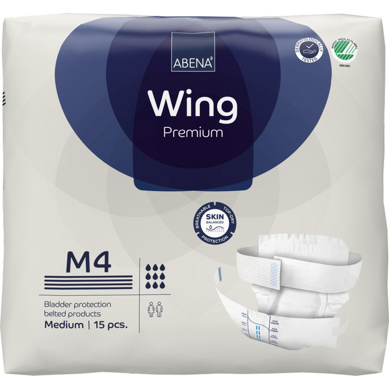 Eine Packung ABENA Wing Premium by Abena Re-Seller GmbH (medium, 15 Stück) mit Verpackung mit Schutz und Komfort, Produktbildern, Markenlogo und Symbolen für Saugfähigkeit und Hautschutz.