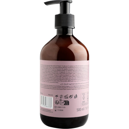 A brown plastic pump bottle of ENA Living Body Lotion (500 ml) from Abena Re-Seller GmbH, shown from the back with a pink label featuring text, recycling symbols, barcode, and volume. Designed for daily body care.