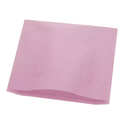 An AMPri Dental headrest cover tissue paper napkin in a delicate pink tone is unfolded in front of a white background, showcasing the smooth texture characteristic of tissue paper. The square design features subtle creases that elegantly highlight the fold lines.