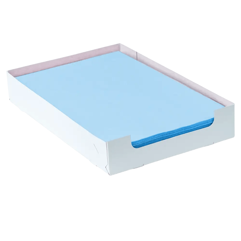A stack of blue AMPri Dental crepe-lined tray filter paper sheets, measuring 18 x 28 cm, is neatly arranged in a white cardboard box from AMPri Handelsgesellschaft mbH. The box is partially open on the sides to allow for easy access. The light-colored, flat paper, which is designed for efficient filtration, has precisely aligned edges inside the container.