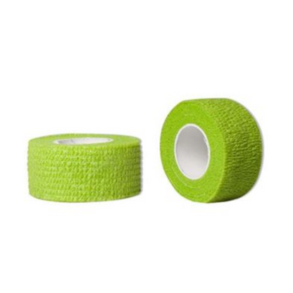 The AMPri Joy2Protect adhesive tape, available in a box with two rolls measuring 2.5 cm x 4.5 m, is shown in green. One roll stands upright while the other lies on its side, revealing the inner core and textured surface. This tape from AMPri Handelsgesellschaft mbH is ideal for medical or sports use, making it suitable for hospital environments or industrial applications.