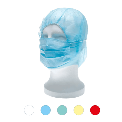 A white mannequin head wears a blue medical disposable cap and mask, resembling the AMPri MED-COMFORT PP astronaut hood with mouth protection. Below the mannequin are five small circles in different colors: white, light blue, blue, yellow, and red, highlighting the versatility of this polypropylene disposable product from AMPri Handelsgesellschaft mbH.