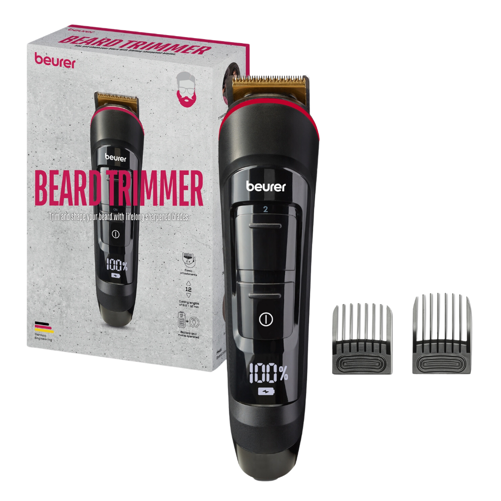 The discontinued item Beurer beard trimmer MN4X with stainless steel blade from Beurer GmbH is seen unpacked, next to it two washable attachment combs; the digital display of the trimmer shows "100%".