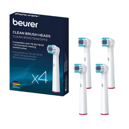 The image shows a box of Beurer brush head Clean for TB 30/TB 50 with four replacement toothbrush heads next to it. The text on the box mentions compatibility with TB 30/TB 50 and all common rotary toothbrushes. A German flag indicates the manufacturing location of this dental care accessory by the Beurer GmbH.