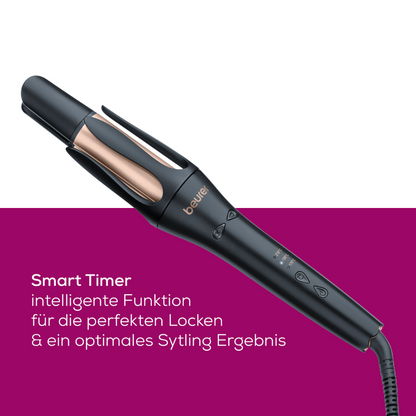 The Beurer HT 75 automatic curling iron from Beurer GmbH features an elegant black design with gold accents. It is equipped with labeled buttons, a digital display on the handle, and a 4-fold ion outlet. The packaging of this premium curling iron displays the text "Smart Timer intelligent function for perfect curls & optimal styling results" on a purple background.