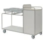 The Novocal station wagon features a robust, fully welded stainless steel frame with round tube connections, four wheels, a flat lower shelf, three upper compartments, a closed cabinet at one end, and a plain white surface.