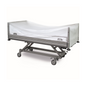 A hospital bed with an adjustable frame on wheels features a translucent HDPE canopy and dark metal rails for hygiene. Brand: EMIL DEISS KG (GmbH + Co.). Product: DEISS Universal bed covers made of HDPE, transparent | Carton (1 pack).