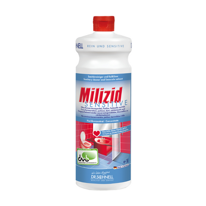 A bottle of Dr. Schnell Milizid Sensitive sanitary cleaner and lime remover with a red cap is specially designed for acid-resistant surfaces. Its function as a cleaner and lime remover for sensitive areas is highlighted by illustrations of a toilet and a shower on the label. The brand name "DR.SCHNELL GmbH & Co. KGaA" is prominently placed at the bottom.