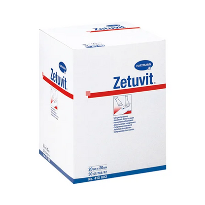 A white box with non-sterile Hartmann Zetuvit absorbent compresses from Paul Hartmann AG with blue-red brand printing. The box features text and images illustrating the absorbent compress.