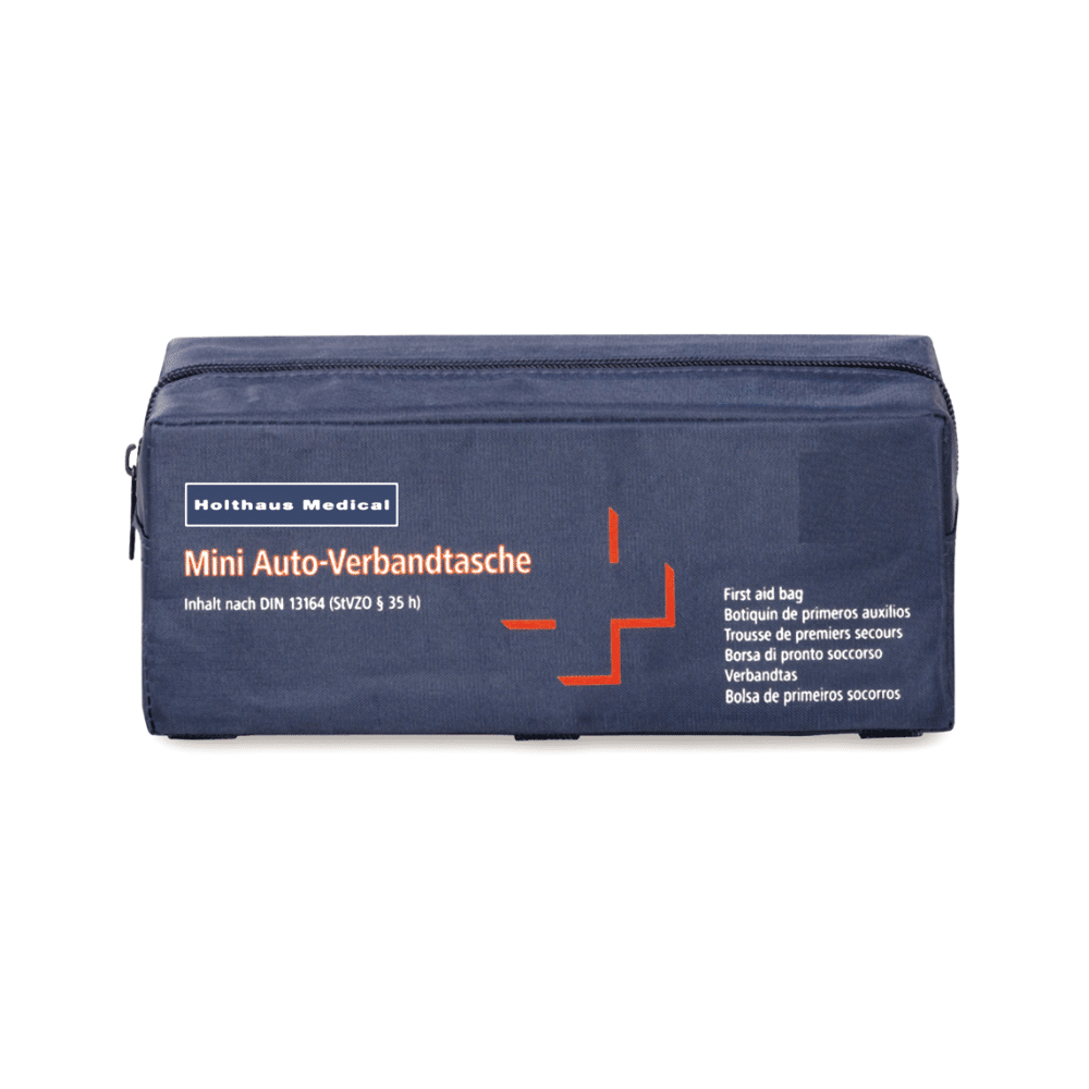 The Holthaus Medical Mini First Aid Bag Auto, manufactured by Holthaus Medical GmbH & Co. KG, is a blue first aid bag that complies with DIN standards 13164. It is rectangular and equipped with a zipper, featuring labels in German, English, French, and Spanish. The visible labeling includes "Mini Auto First Aid Bag" and "First Aid Bag," making it ideal for all car emergencies.