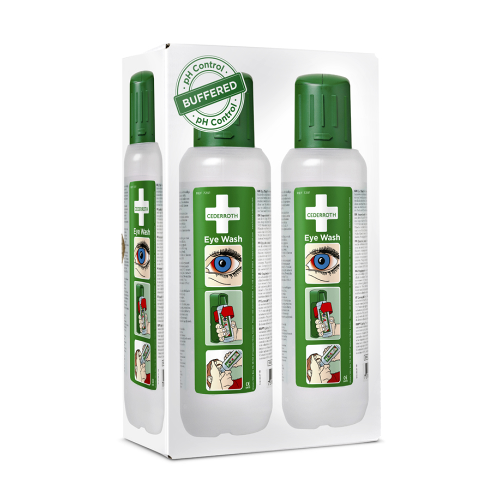 Picture of a white box with two bottles with green caps and the label "Holthaus Eye Wash Bottle, stationary 2 x 500 ml". The box contains instructions with illustrations for using the eye wash, including pictures of an eye and a person applying the solution. The text highlights features such as "pH control" and "Buffered" for effective first aid. Product by Holthaus Medical GmbH & Co. KG.