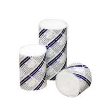 Shown are three cylindrical cotton rolls in partially opened white and blue packaging. Two rolls of Holthaus Ypsiform padding bandage from Holthaus Medical GmbH & Co. KG are standing upright, while one roll is lying on its side showing the white cotton end.