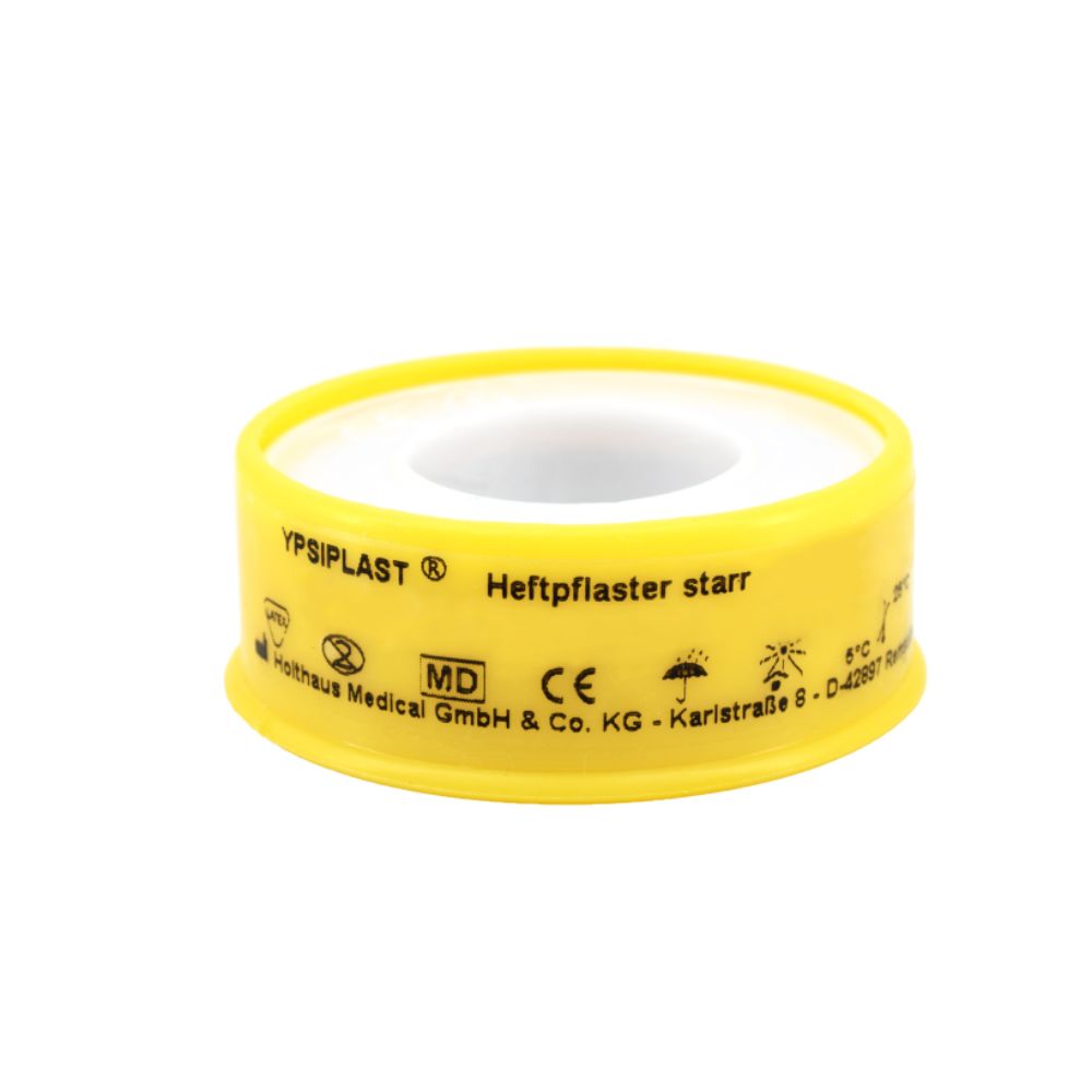 The Holthaus Ypsiplast® adhesive plaster, rigid from Holthaus Medical GmbH & Co. KG, is a medical adhesive tape with a yellow plastic cover and printed texts and symbols for effective wound care with high adhesive strength for reliable medical use.
