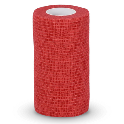 A red, cylindrical roll of Holthaus VliVet® self-adhesive bandage for veterinary use from Holthaus Medical GmbH & Co. KG, designed to adhere to itself without sticking to skin or hair. The roll stands upright on a plain white background, with a hollow core visible in the middle – ideal for use in hoof care and the veterinary field.