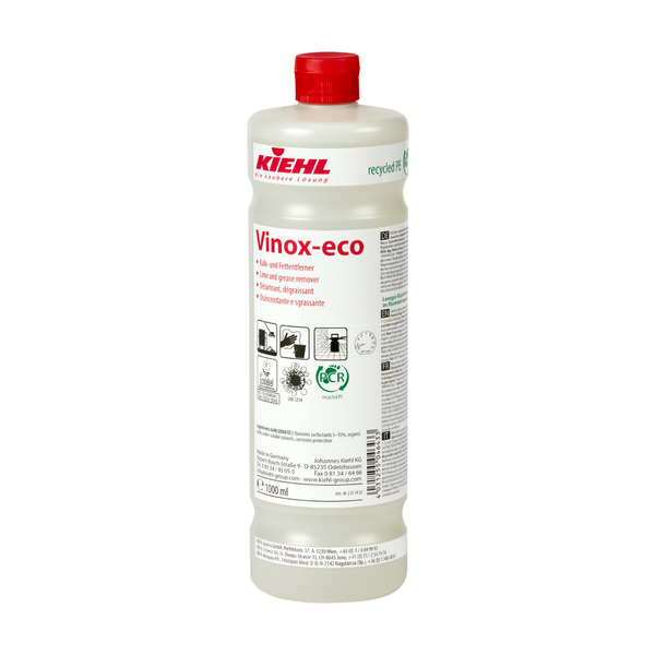 White plastic bottle of the Kiehl Vinox-eco lime and grease remover from Johannes Kiehl KG with a red cap. The front label contains product information, application instructions, and pictograms.