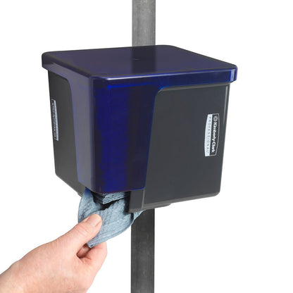 A person pulls a hygiene cloth from a gray Kimberly-Clark Professional™ wipe dispenser - quarter-folded from Kimberly-Clark GmbH, which is attached to a vertical metal rod.