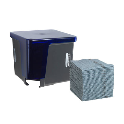 A gray Kimberly-Clark Professional™ wipe dispenser from Kimberly-Clark GmbH stands next to a clean stack of quarter-folded wipes, allowing for hygienic removal. Both elements are placed against a plain white background.