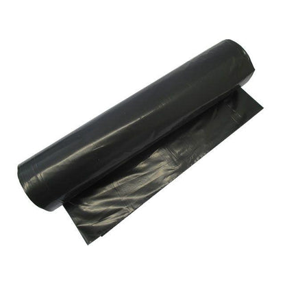 A roll of Abena Re-Seller GmbH garbage bags 70 L (575x1000 mm, 32 my LDPE) for waste disposal, with a black garbage bag partially unrolled and lying flat.