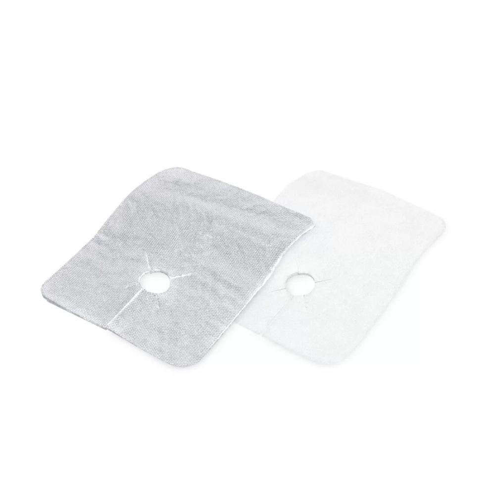 Two rectangular fabric compresses with a central hole, known as Meditrade ABE® Tracheal, slit hole compress 8 x 10 cm | Pack (50 pieces) by Meditrade GmbH. The compress on the left is gray and the compress on the right is white, both feature a centrally running quilting seam and a metallic coating for added comfort.