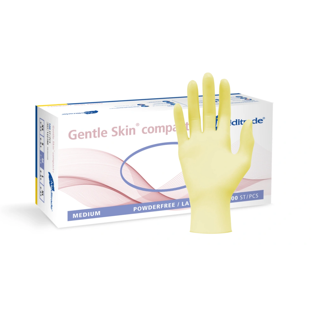 Displayed is a box of medium-sized, powder-free medical gloves Meditrade Gentle Skin® Latex Gloves compact+ disposable gloves, with a yellow latex disposable glove stretched out in front.