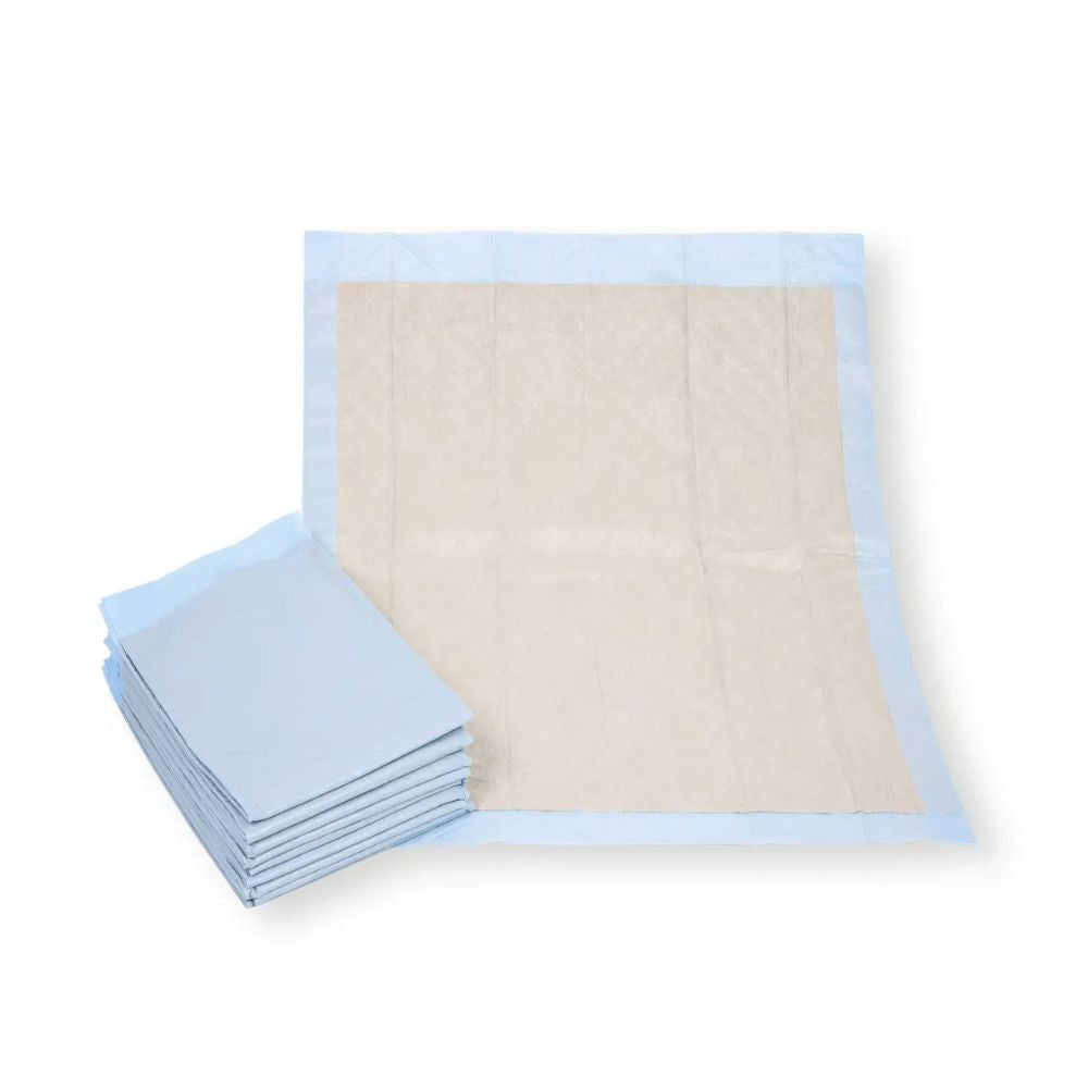 Next to an open pad, there is a stack of Meditrade bed protection pads 60 x 90 cm made from environmentally friendly recycled cellulose. With their rectangular design featuring a blue border and beige center, these pads from Meditrade GmbH offer hygiene or protection.