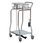 A stainless steel medical cart with four wheels, wire basket, flat shelf, lower shelf, handles, foot pedal, dispenser for disposable gloves, and a Novocal collector for foil tubing made of stainless steel attached to one side (1 piece).