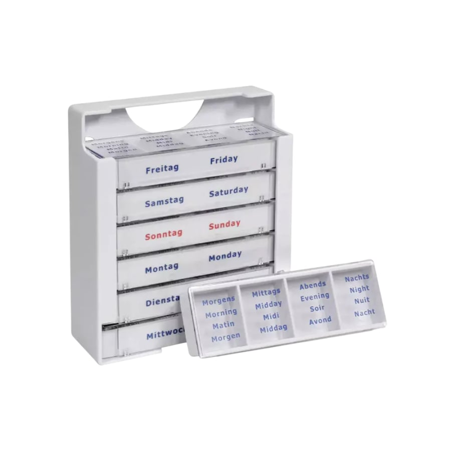 The Med-Comfort Tablet Dispenser (375 x 225 x 40 mm, white) from AMPri Handelsgesellschaft mbH is a weekly pill organizer with seven drawers, labeled in German/English for easy medication management; one of them shows the times of the day in multiple languages.