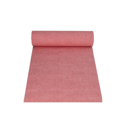 A PAPSTAR table runner fabric-like PV-Tissue Mix from the "ROYAL Collection" of PAPSTAR GmbH in the dimensions 24 m x 40 cm and the color red is partially unrolled, with the roll facing up, against a flawlessly white background.