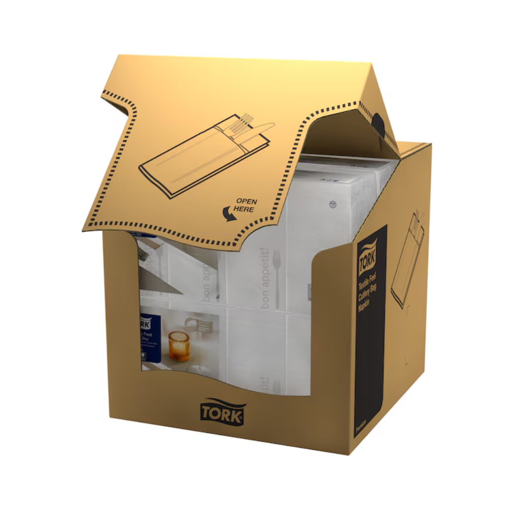 A partially opened carton labeled "Tork 13662 Tork Soft Guten Appetit Cutlery Bag | Carton (6 packs)" from the brand TORK – Essity Professional Hygiene Germany GmbH contains white paper napkins, also known as paper napkins. The carton features a perforated opening for easy access and includes an illustration showing how to open it, with "Open here" clearly visible on the top flap.