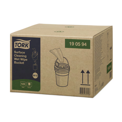 A box of Tork 190594 wet surface cleaning wipes Premium W15 1-ply from TORK – Essity Professional Hygiene Germany GmbH shows an image of a bucket with wet wipes on the side. The packaging is labeled with product details and a barcode, highlighting these high-quality cleaning wipes for efficient surface cleaning.