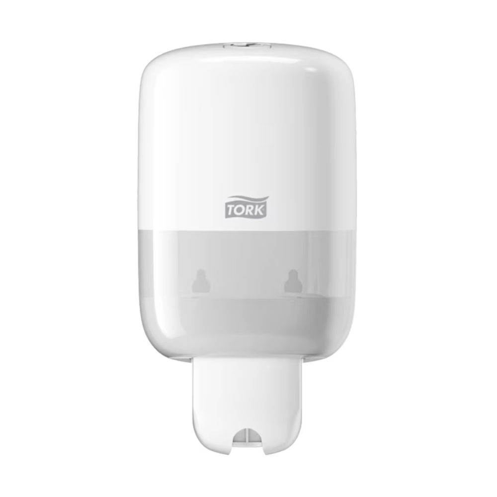 The Tork 561000 Mini Dispenser for Liquid Soap Elevation S2, manufactured by Essity Professional Hygiene Germany GmbH under the TORK brand, features a sleek and modern Elevation design with a transparent lower part for easy wall-mounting. The distinctive Tork logo is visible on the front, while the bottom contains an efficient dispensing slot.