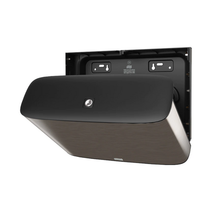 Cuirimid i láthair an Tork Xpress® 460006, dáileoir balla ón Image Line T2. Leis an dearadh simplí dubh, léiríonn an dáileoir páipéar leithris Mini-Jumbo seo ó TORK – Essity Professional Hygiene Germany GmbH i ndearadh galánta cruach dhosmálta. Tá an cúlbhalla le poill suiteála le feiceáil agus léiríonn sé go bhfuil sé réidh le suiteáil.