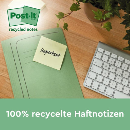 A green folder with a Post-it® Recycling Z-Note from 3M Deutschland GmbH labeled "Important" lies on a wooden desk next to a white keyboard and a green plant. Text below: "100% PEFC eco-friendly notes, 76x76mm, 100 sheets/block, 6 blocks/pack.