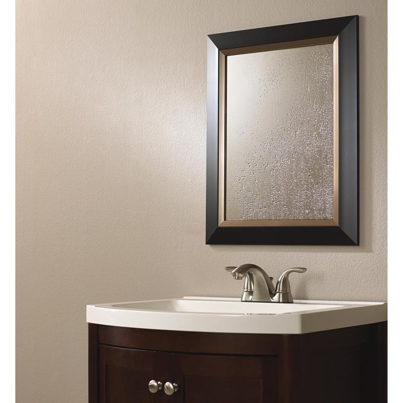Under a rectangular wall mirror is a sink with a dark wood cabinet and a silver faucet. The mirror, framed in dark wood and fogged by condensation, is securely mounted with 3M Deutschland GmbH Scotch-FIX™ Mirror Mounting Tape 4496W.