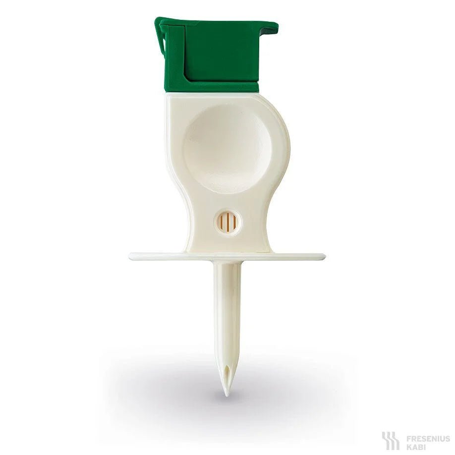 Pictured is a white plastic adapter from Servoprax GmbH (Extra-Spike Plus, without particle filter, with 3 µm ventilation filter) with a green flip cap and pointed tip on a white background. Packaging: 25 pieces.