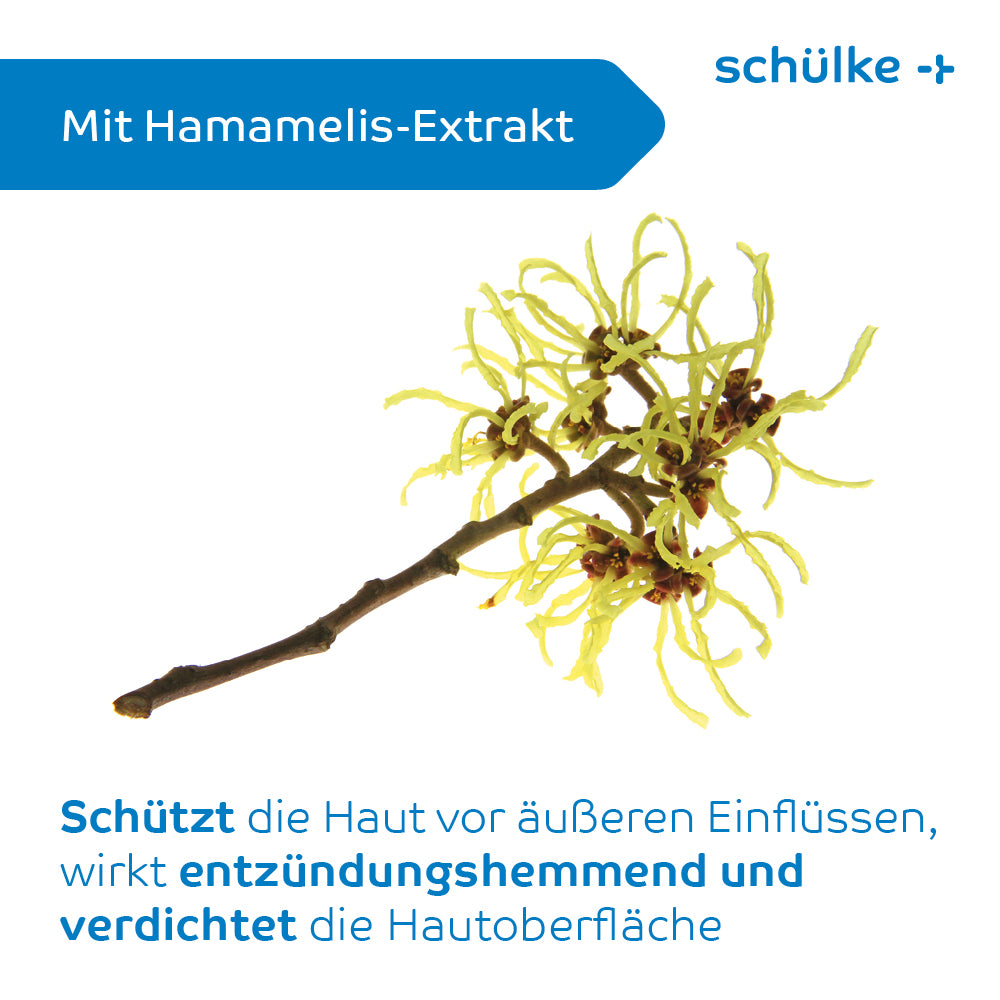 Auf weißem Hintergrund ist ein Zweig der Hamamelis mit gelben Blüten abgebildet. Der Text lautet „Mit Hamamelis-Extrakt“ und beschreibt in deutscher Sprache die hautschützenden Vorteile, einschließlich der Linderung von Hautirritationen. Auf der Verpackung der Schülke sensiva® Schutzcreme ist in blauer Schrift „Schülke & Mayr GmbH“ abgebildet.